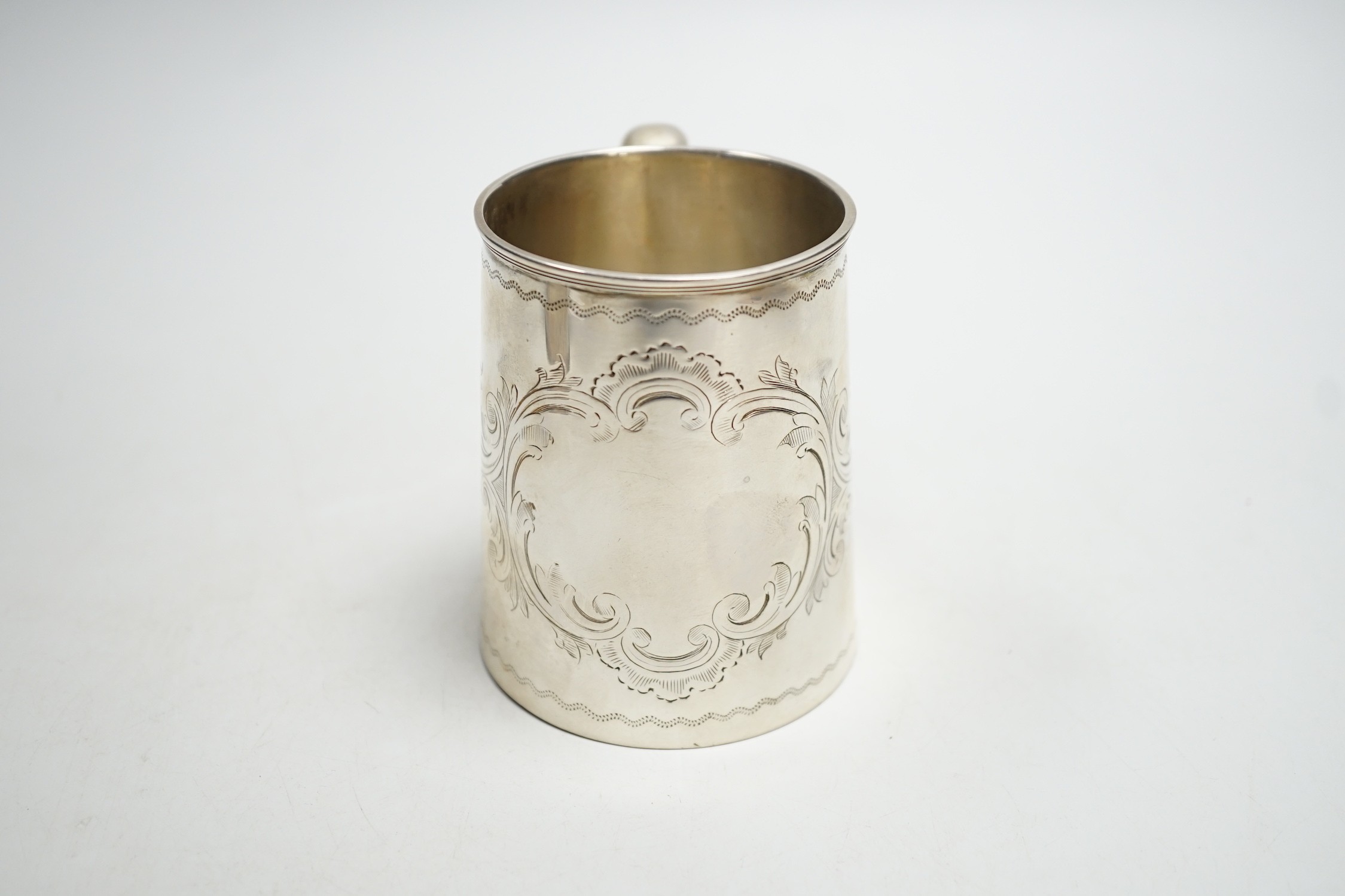 A Victorian engraved silver christening mug, Thomas White, Birmingham, 1872, 87mm.